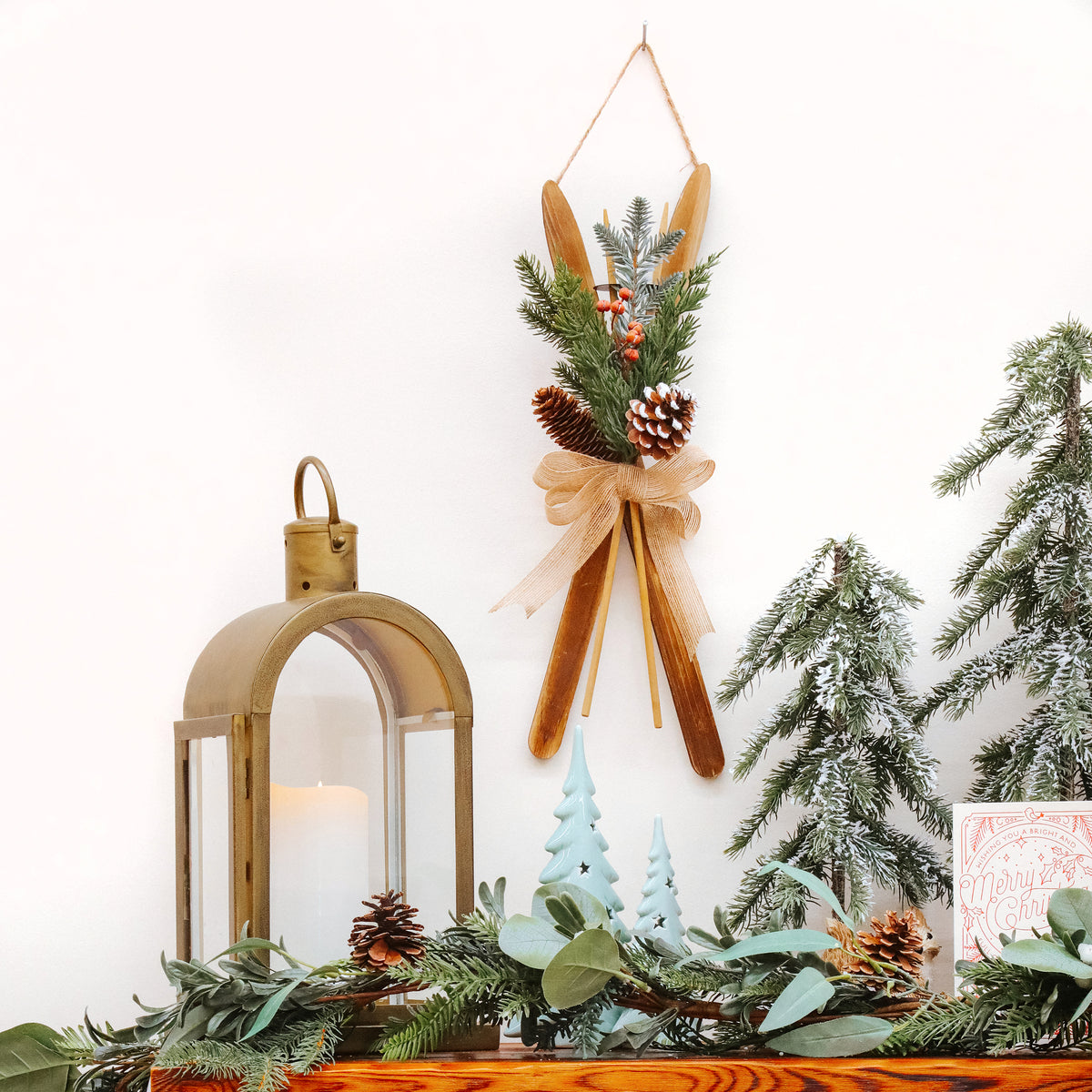 National Tree Company Christmas Wall Decoration, Brown, Wooden, Holiday Skis, Red Berries, Evergreen Tips, Pine Cones with Linen Bow, 17 Inch